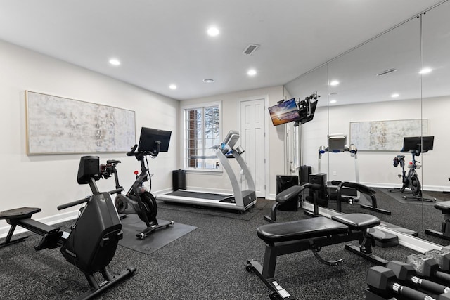 exercise room featuring baseboards, visible vents, and recessed lighting