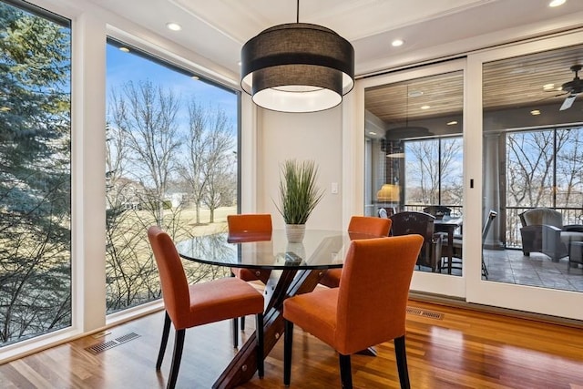 dining room featuring visible vents, wood finished floors, and recessed lighting