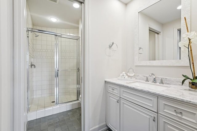 bathroom featuring a stall shower, vanity, toilet, and recessed lighting