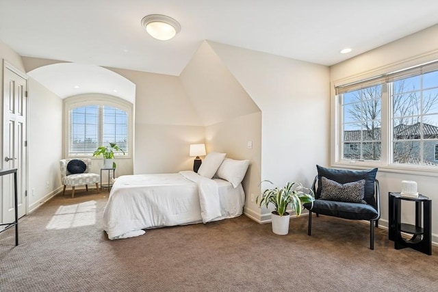 carpeted bedroom featuring baseboards and recessed lighting