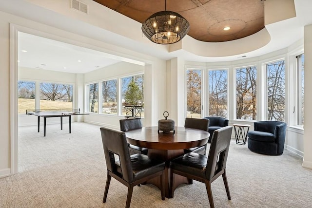 dining space with a notable chandelier, recessed lighting, light colored carpet, visible vents, and baseboards