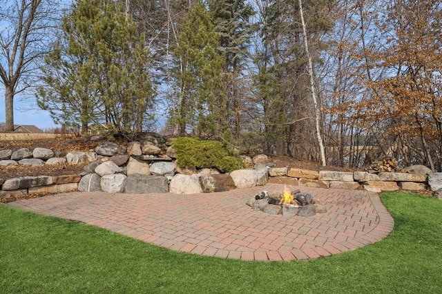 view of patio / terrace with an outdoor fire pit