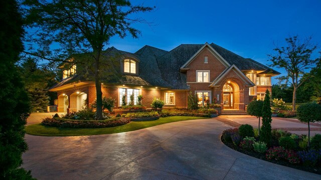 18313 Nicklaus Way, Eden Prairie, MN 55347 - view of front facade featuring brick siding and curved driveway