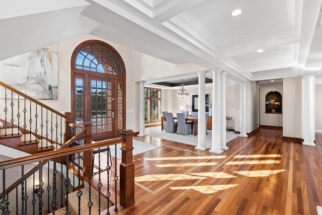 18313 Nicklaus Way, Eden Prairie, MN 55347 - entrance foyer featuring wood finished floors, decorative columns, stairs, recessed lighting, and baseboards