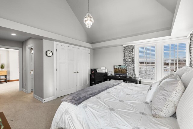 18313 Nicklaus Way, Eden Prairie, MN 55347 - bedroom featuring vaulted ceiling, light colored carpet, baseboards, a chandelier, and a closet