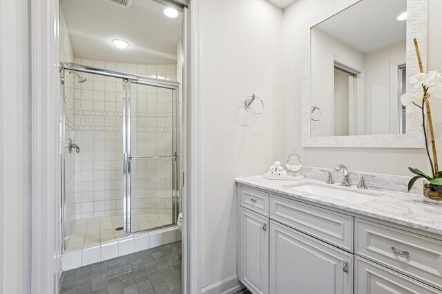 18313 Nicklaus Way, Eden Prairie, MN 55347 - bathroom featuring a stall shower, vanity, toilet, tile patterned floors, and recessed lighting
