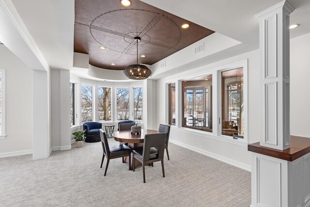 18313 Nicklaus Way, Eden Prairie, MN 55347 - dining space featuring a raised ceiling, carpet floors, ornate columns, baseboards, and recessed lighting