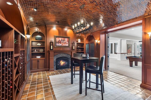 18313 Nicklaus Way, Eden Prairie, MN 55347 - wine area with built in features, vaulted ceiling, a lit fireplace, carpet flooring, and pool table