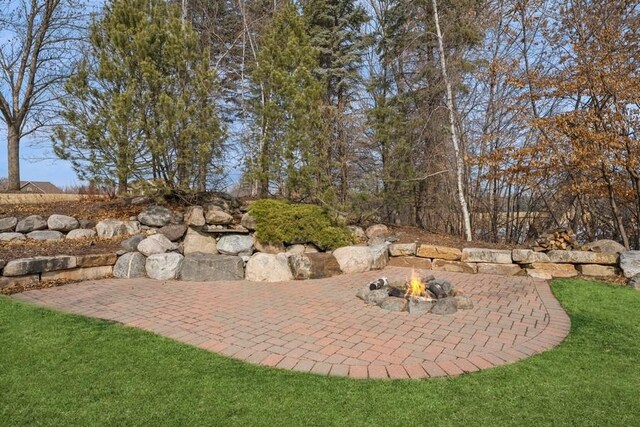 18313 Nicklaus Way, Eden Prairie, MN 55347 - view of patio / terrace featuring a fire pit