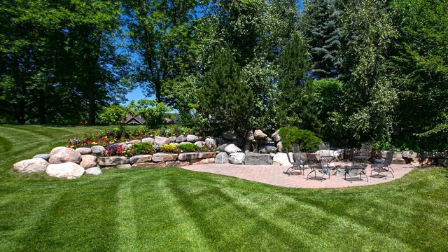 18313 Nicklaus Way, Eden Prairie, MN 55347 - view of grassy yard with a patio area