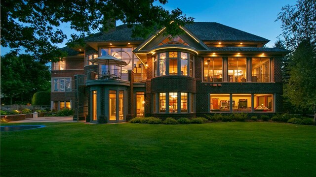 18313 Nicklaus Way, Eden Prairie, MN 55347 - back of property featuring a balcony and a lawn