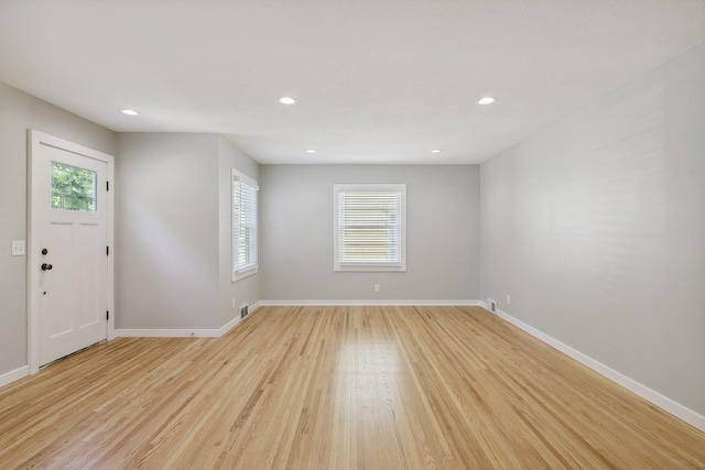 entrance foyer with light wood finished floors, baseboards, and recessed lighting