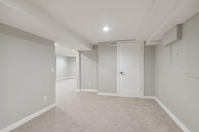 finished below grade area with recessed lighting, baseboards, visible vents, and light colored carpet