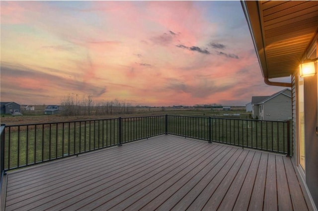 deck at dusk with a lawn