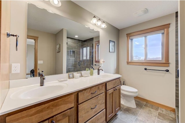 bathroom featuring vanity, toilet, and walk in shower