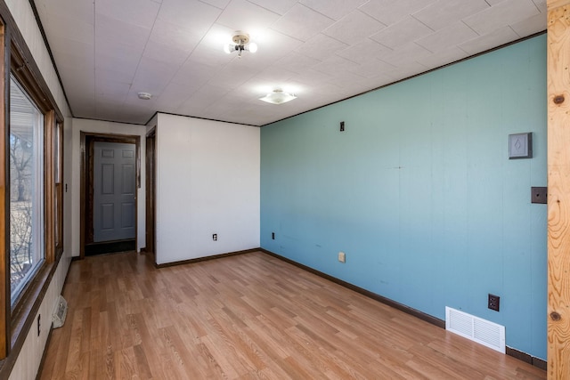 unfurnished room featuring light hardwood / wood-style floors