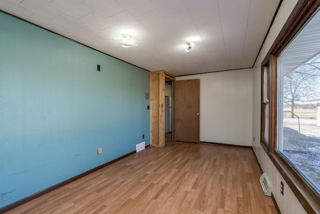 empty room with light wood-type flooring