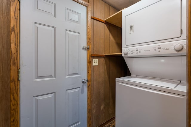 laundry area with stacked washer and clothes dryer