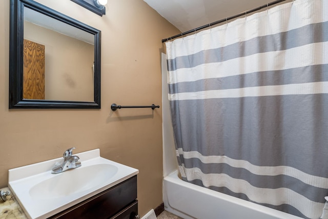 bathroom with vanity and shower / bath combo with shower curtain