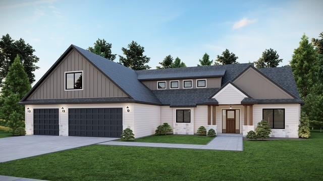 view of front of home with a garage and a front lawn