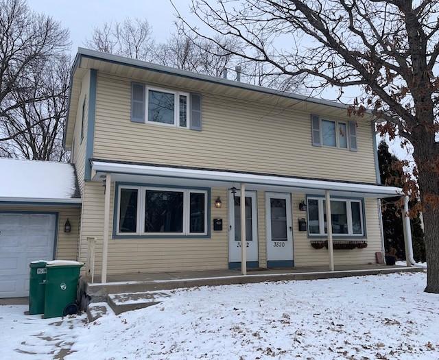 view of front property featuring a garage and a porch