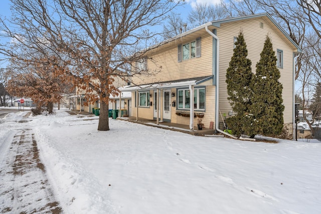 view of snow covered property