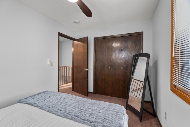 bedroom with baseboards, carpet, a ceiling fan, and a closet