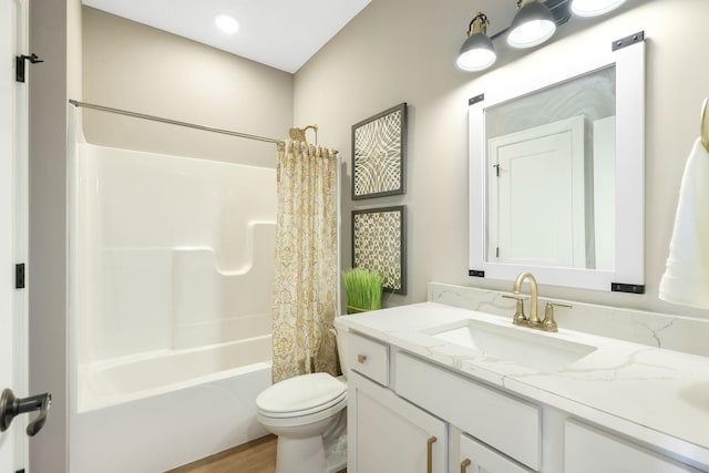 full bathroom featuring shower / tub combo with curtain, vanity, wood-type flooring, and toilet