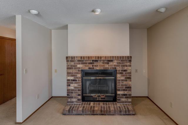 details with a fireplace, carpet floors, and a textured ceiling