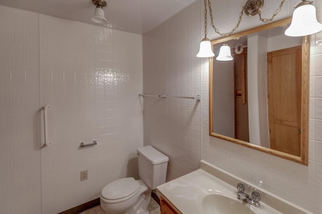 bathroom with tile walls, decorative backsplash, vanity, and toilet