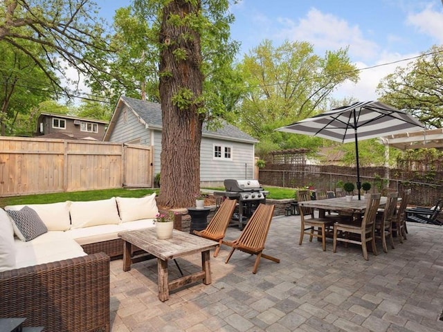 view of patio with a grill and outdoor lounge area