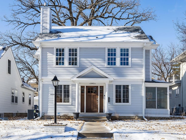 view of front of house featuring cooling unit