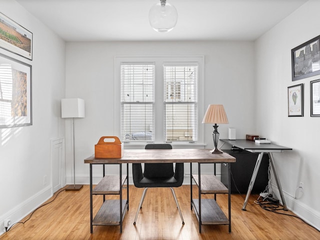 office with light wood-type flooring