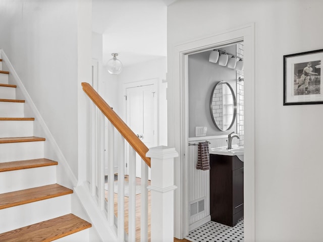 staircase with sink