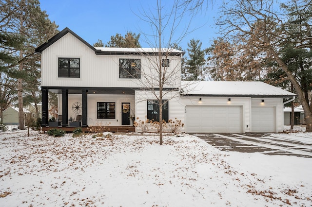 view of front of house featuring a garage and a porch