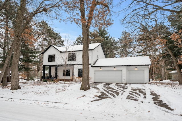 view of front of property featuring a garage and a porch