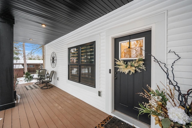 wooden terrace with a porch