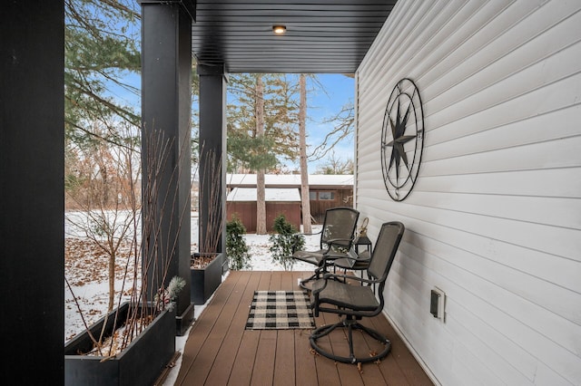 view of snow covered deck