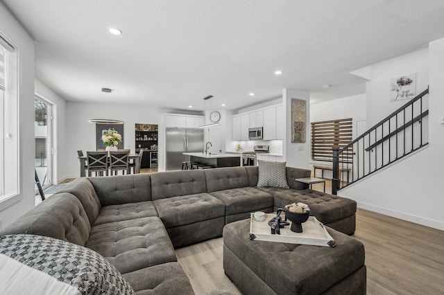 living room with light hardwood / wood-style flooring