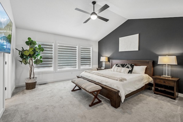 carpeted bedroom with lofted ceiling and ceiling fan