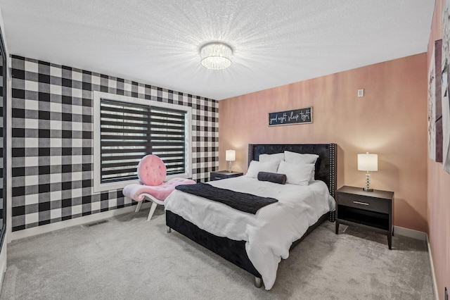 carpeted bedroom with a textured ceiling