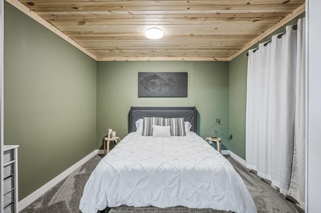 carpeted bedroom featuring wood ceiling