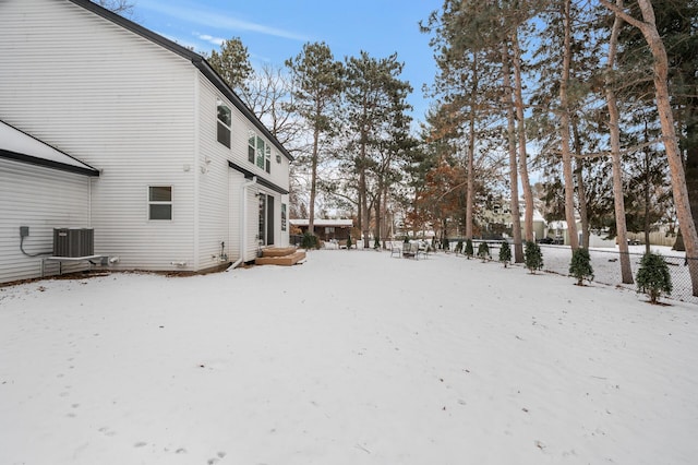 snowy yard with central air condition unit