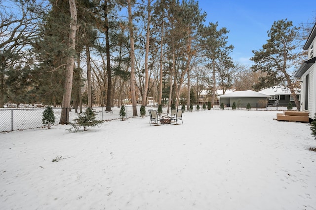 view of yard layered in snow