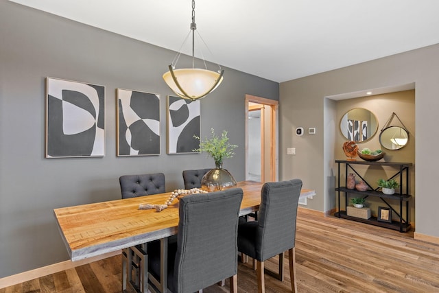 dining area featuring hardwood / wood-style floors