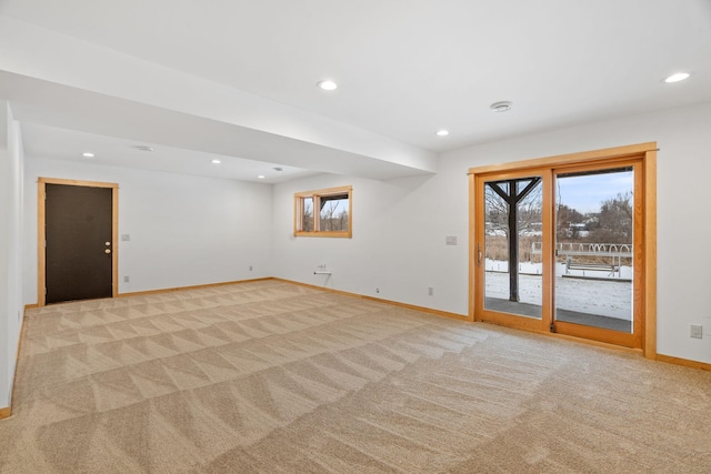 carpeted spare room with a healthy amount of sunlight