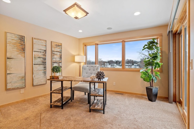 office area featuring light colored carpet