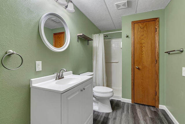 bathroom with vanity, curtained shower, wood-type flooring, and toilet