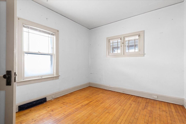 spare room with light wood-type flooring