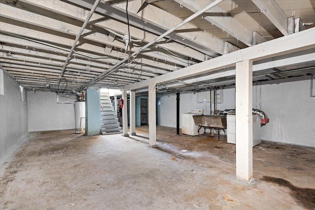 basement with sink, washer / dryer, and water heater